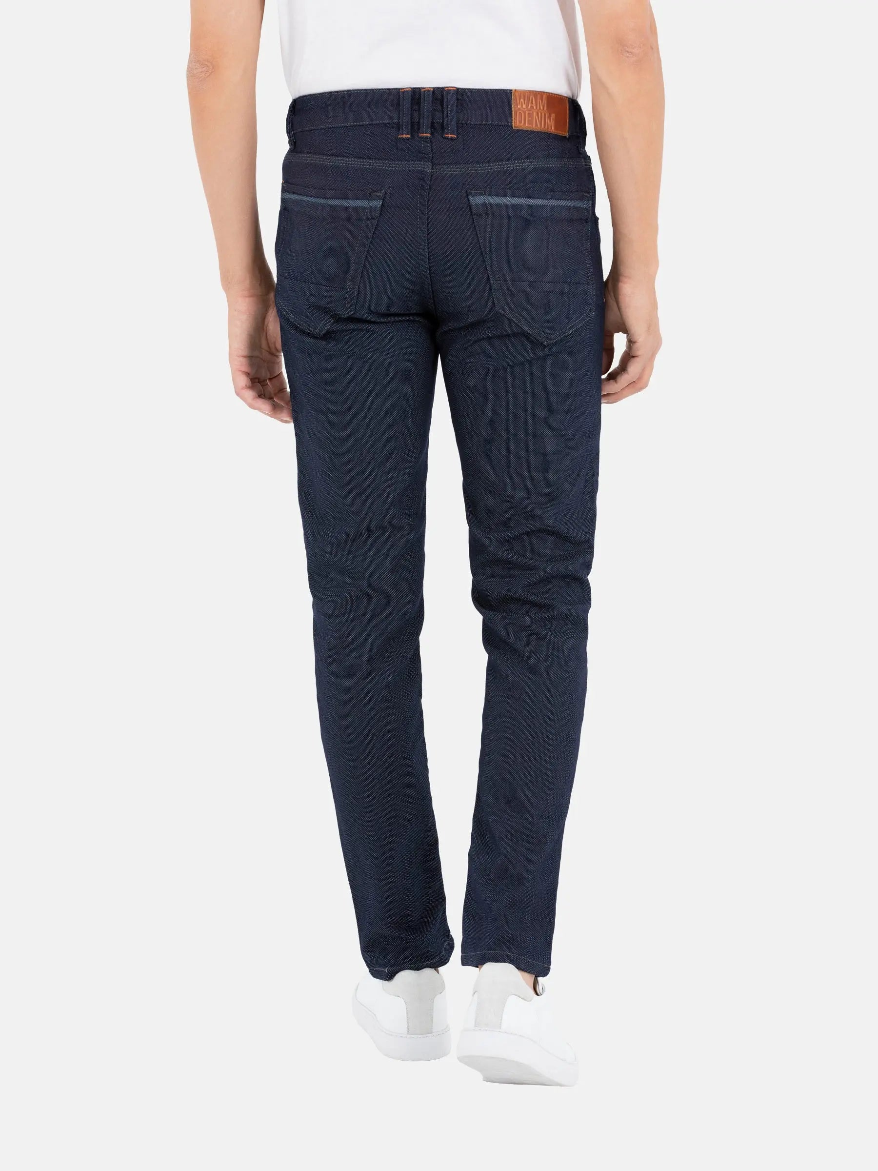 Back view of men’s slim-fit dark blue jeans with stitched pockets – Wam Denim.