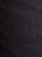 Close-up of black textured denim fabric with fine dotted weave pattern – Wam Denim.