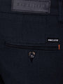 Close-up of navy textured chinos with Wam Classic label and buttoned back pocket – Wam Denim.