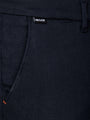 Front pocket detail of navy textured chinos with Wam Classic label – Wam Denim.