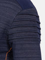 Close-up of a textured navy fabric with pleated detailing on a white background