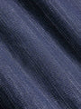 Close-up of sweater fabric with a subtle pattern