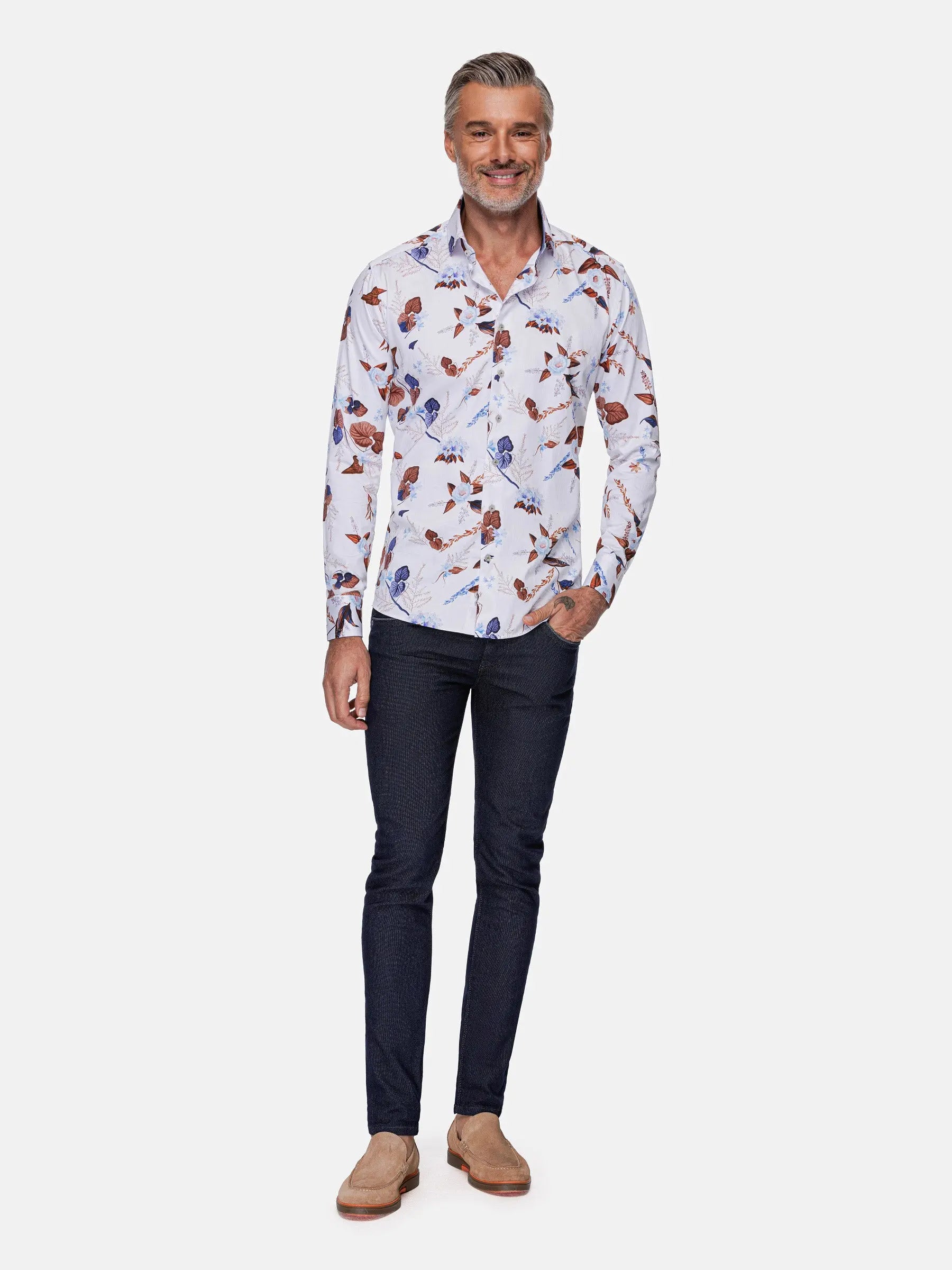 Full-body view of man wearing white floral long-sleeve shirt with dark jeans – Wam Denim.