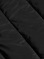 
Close-up texture of the black puffer jacket's quilted nylon fabric – Wam Denim.