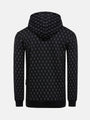 Back view of black patterned hoodie with geometric print and ribbed hem – Wam Denim.