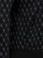 Close-up of black patterned hoodie pocket with stitched geometric design and ribbed hem – Wam Denim.