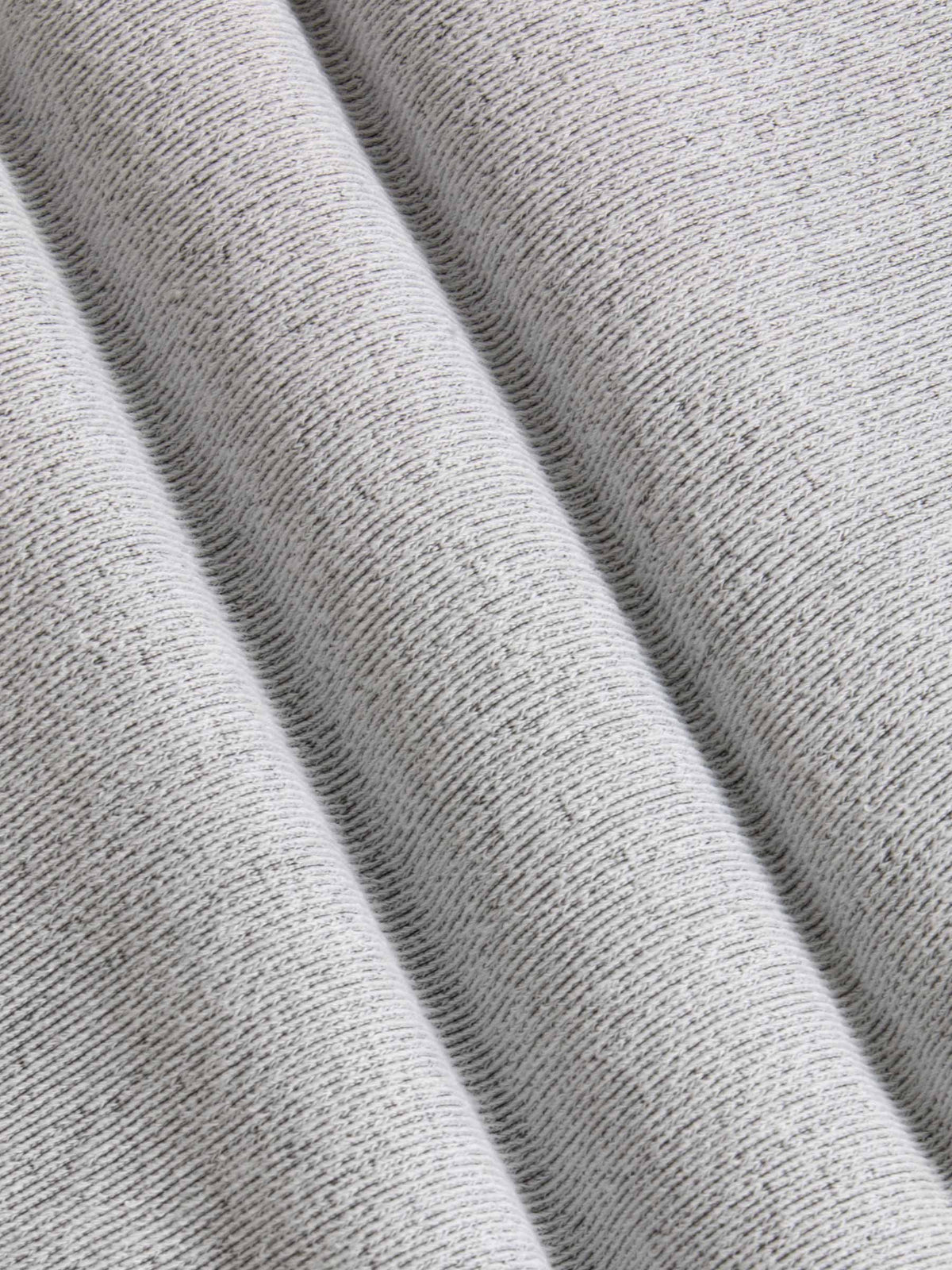 Close-up of textured gray fabric with folds
