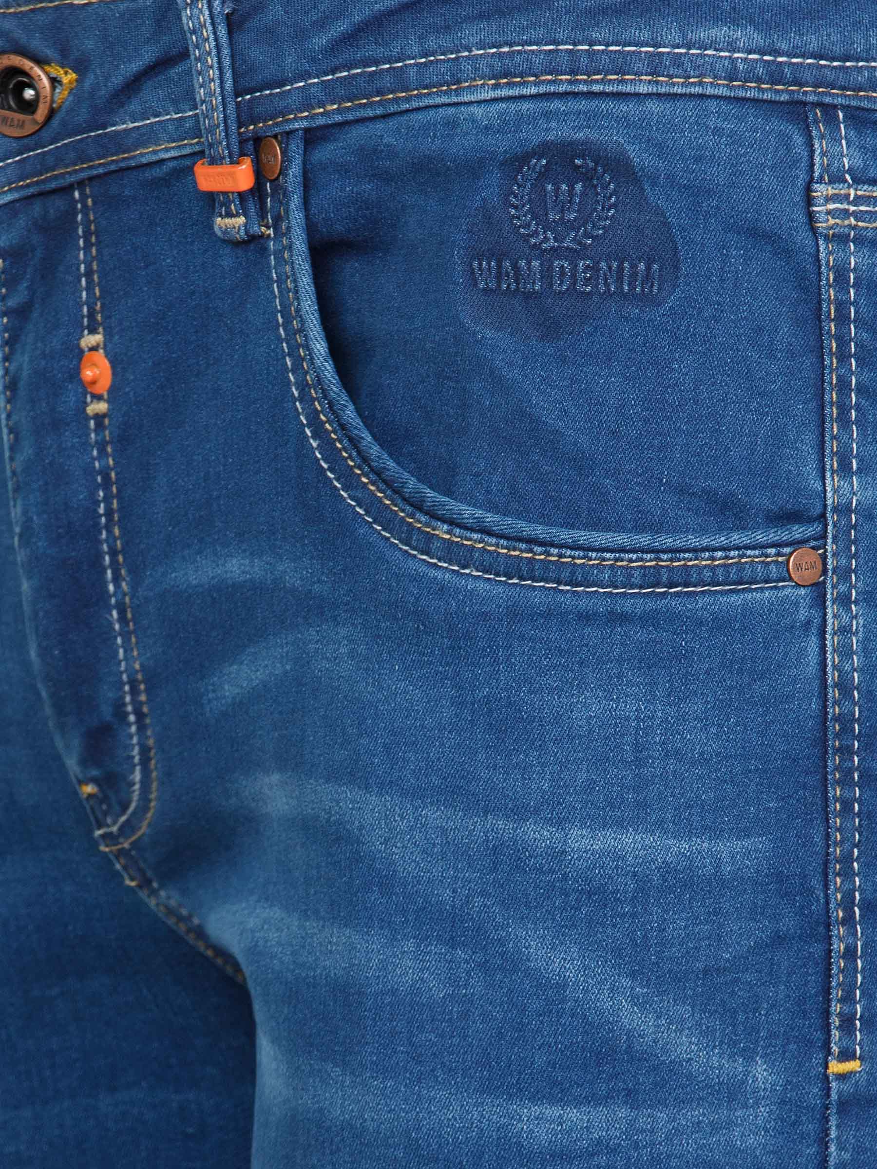 Close-up of light blue jeans pocket with embossed Wam Denim logo and orange accents – Wam Denim.