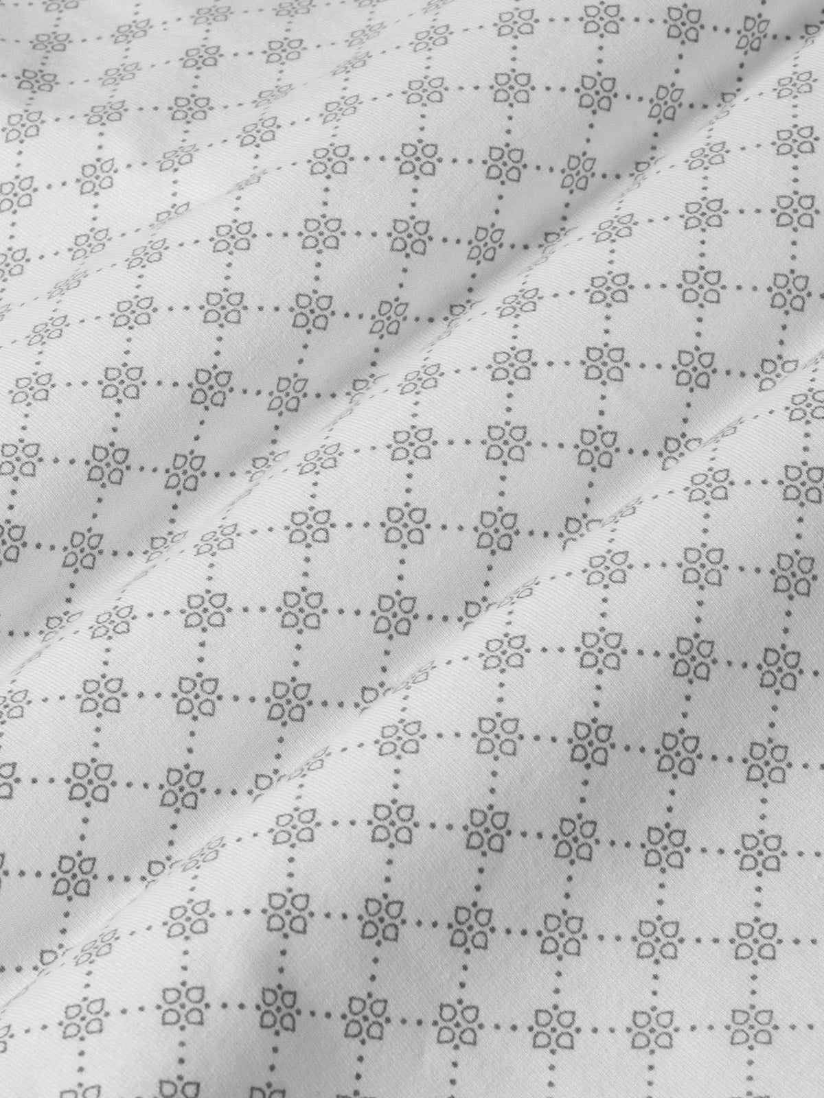 Close-up of grey white Damir Polo fabric pattern. – Wam Denim.