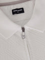 Close-up of the zipper and collar on the white zip polo shirt – Wam Denim.