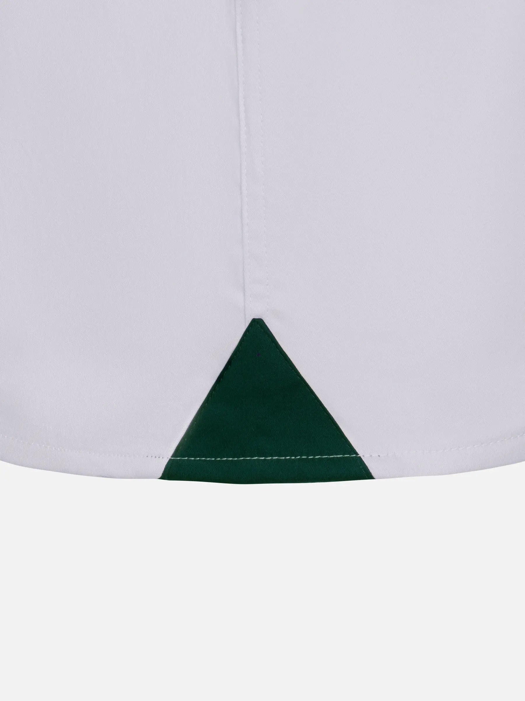 Close-up of the hem split on a white men's dress shirt – Wam Denim.