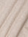 Close-up of beige fabric with a textured pattern