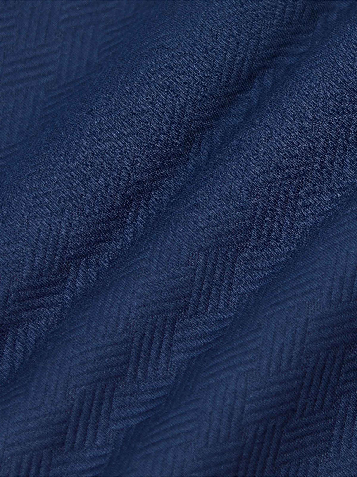 Close-up of textured navy Moorland Sweater fabric. – Wam Denim.