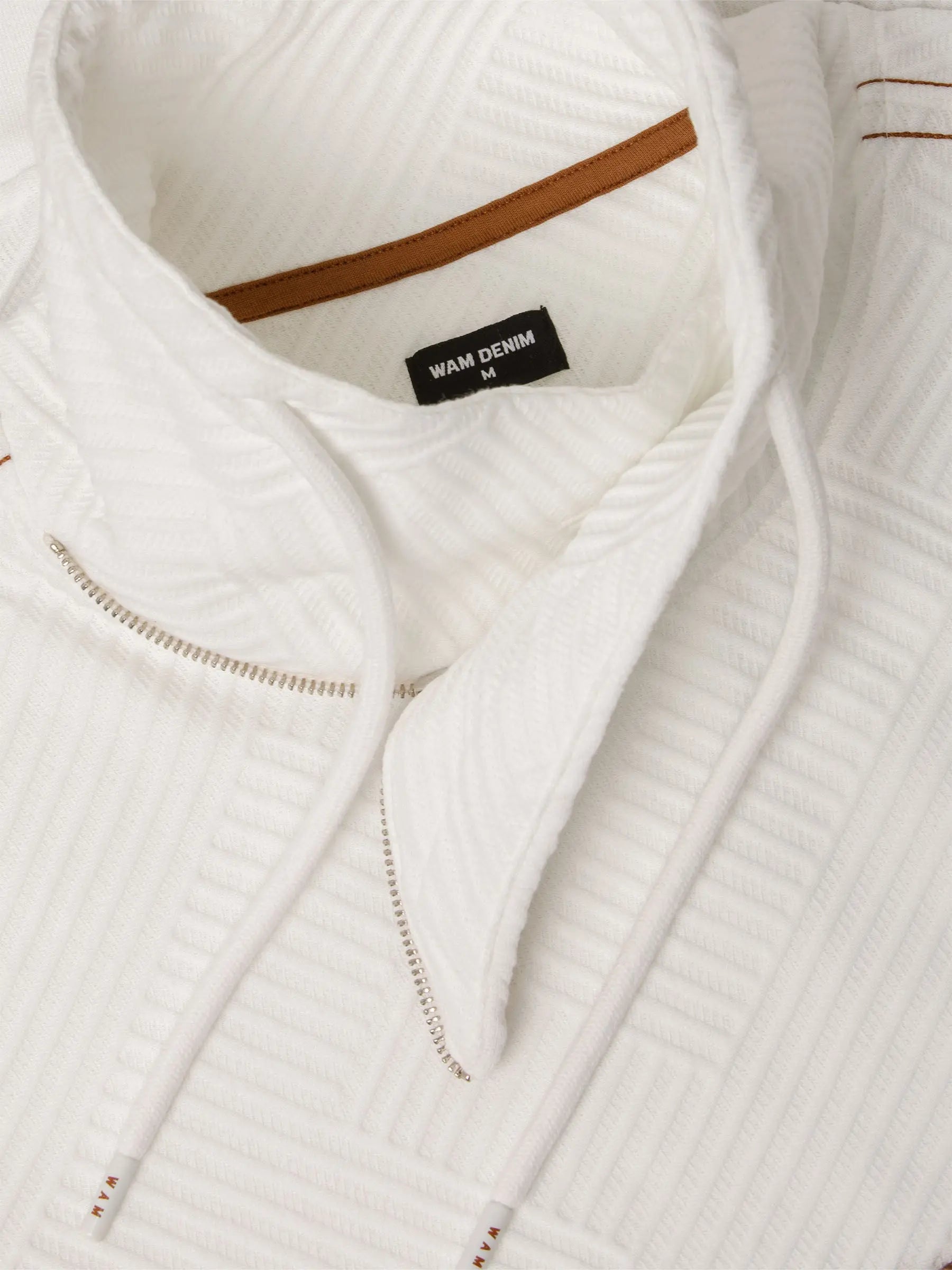 Close-up of white textured turtleneck sweatshirt with drawstrings and Wam Denim label – Wam Denim.
