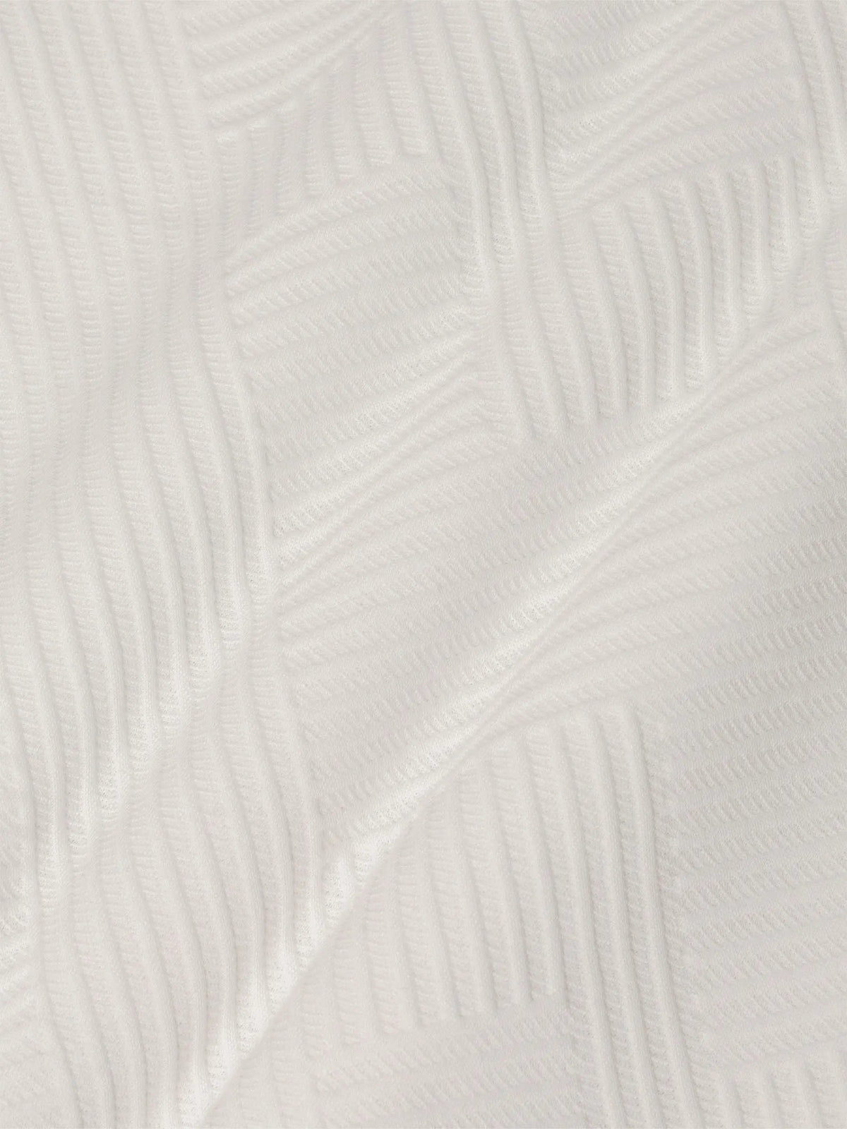 Close-up of white sweatshirt fabric featuring soft geometric textured pattern – Wam Denim.