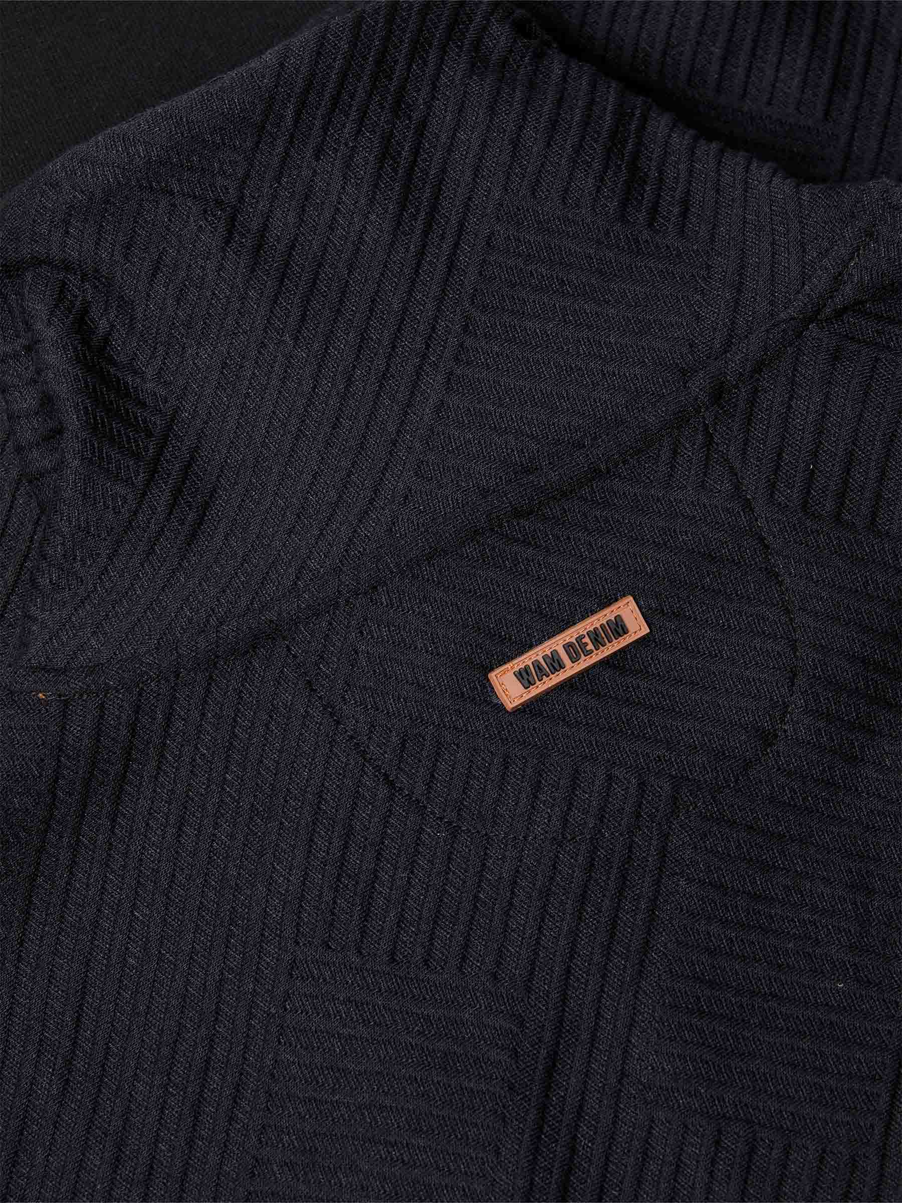Close-up of chest logo and drawstring detail on black textured sweater – Wam Denim.