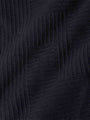 Detailed texture view of ribbed black knit sweater fabric – Wam Denim.