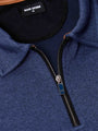 Close-up of light indigo quarter-zip collar and zipper detail with Wam Denim label – Wam Denim.