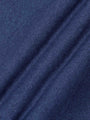 Close-up texture of light indigo knit fabric showing soft and smooth weave – Wam Denim.