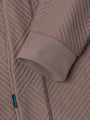 Close-up of the ribbed cuff and knit fabric on the sweater – Wam Denim.