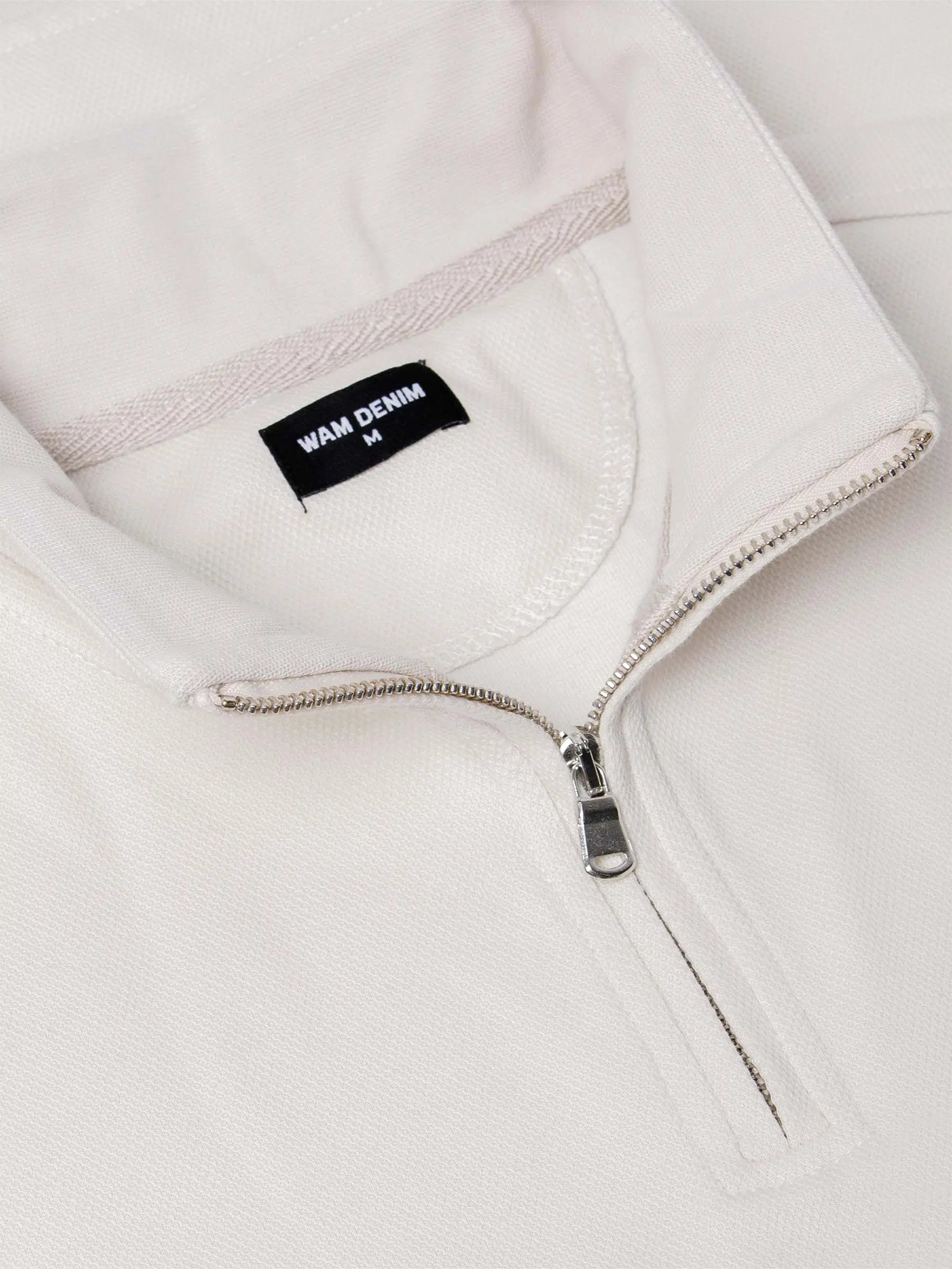 Close-up of light beige Milburn Sweater collar. – Wam Denim.