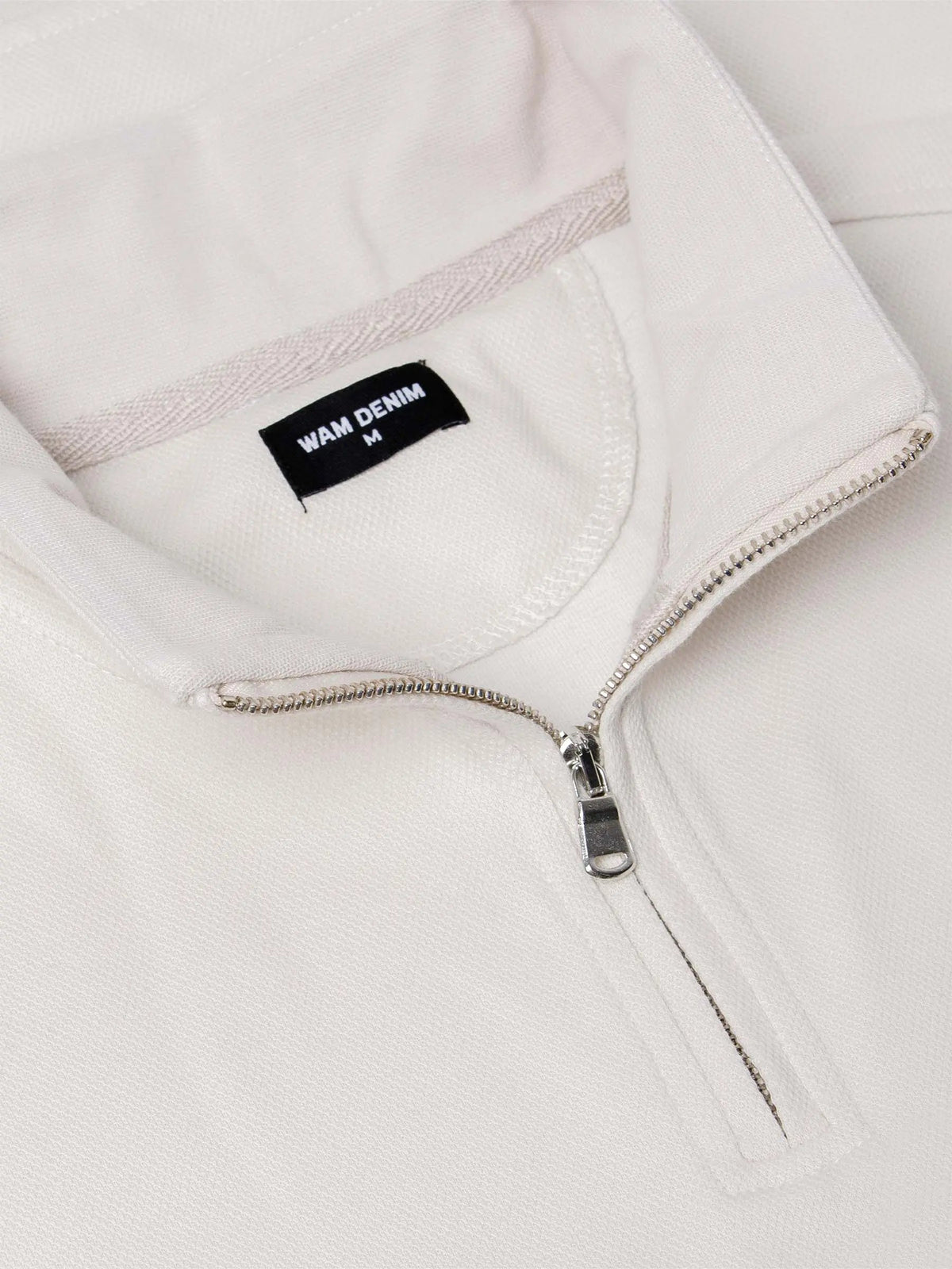Close-up of light beige Milburn Sweater collar. – Wam Denim.
