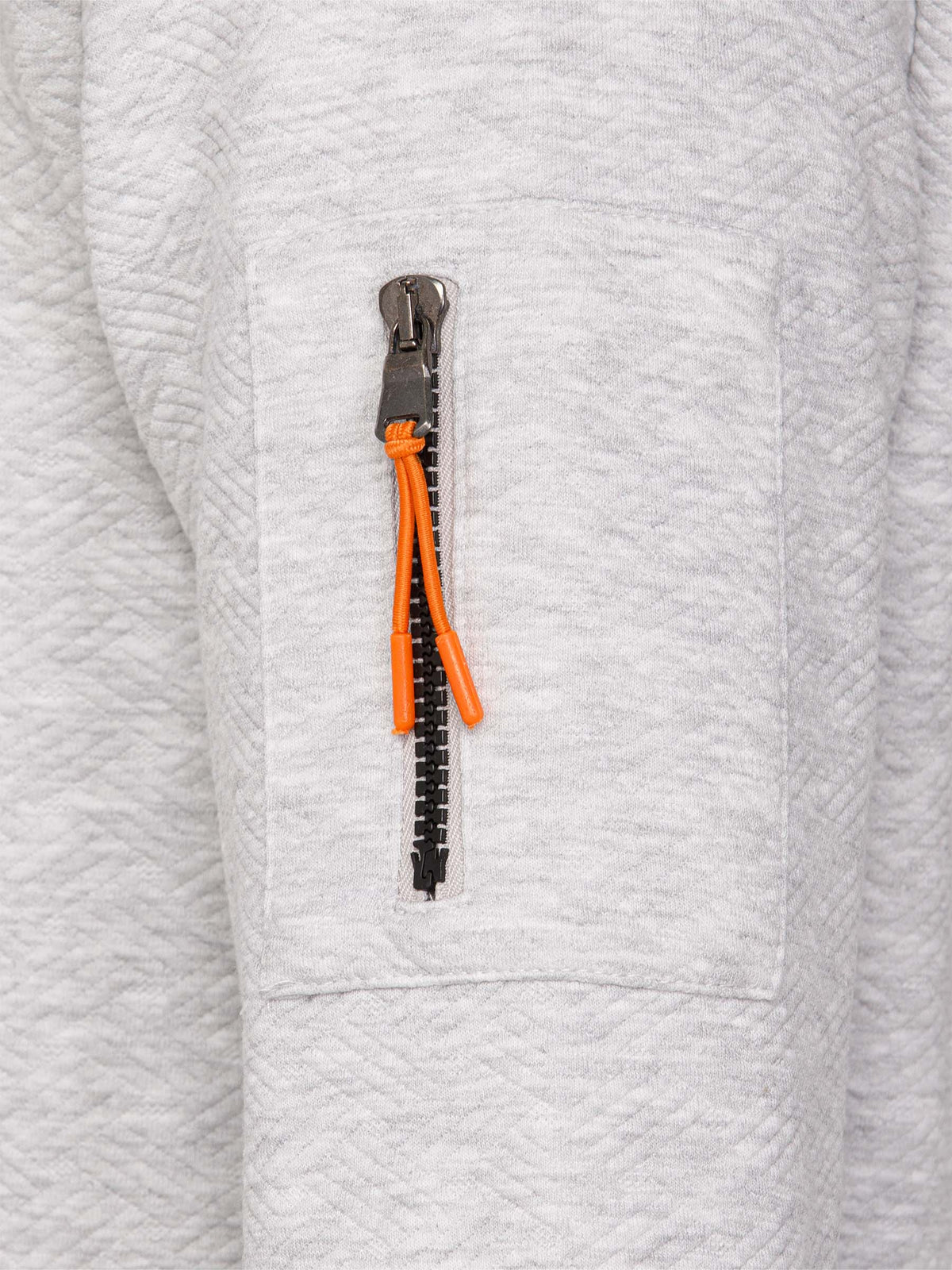 Close-up of grey textured sweatshirt sleeve with orange zipper pocket detail – Wam Denim.