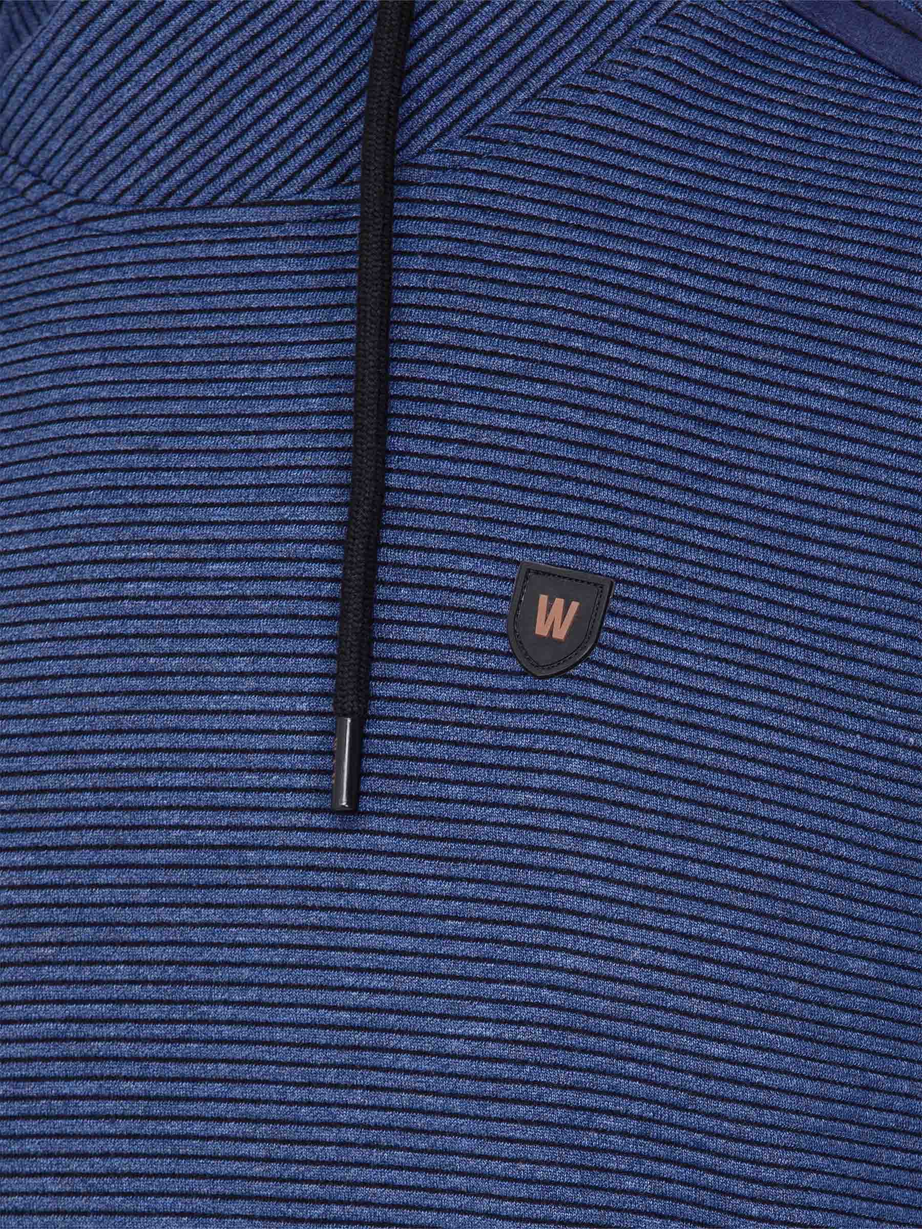 Close-up of the W-shield logo and drawstring on the blue stripe sweater – Wam Denim.