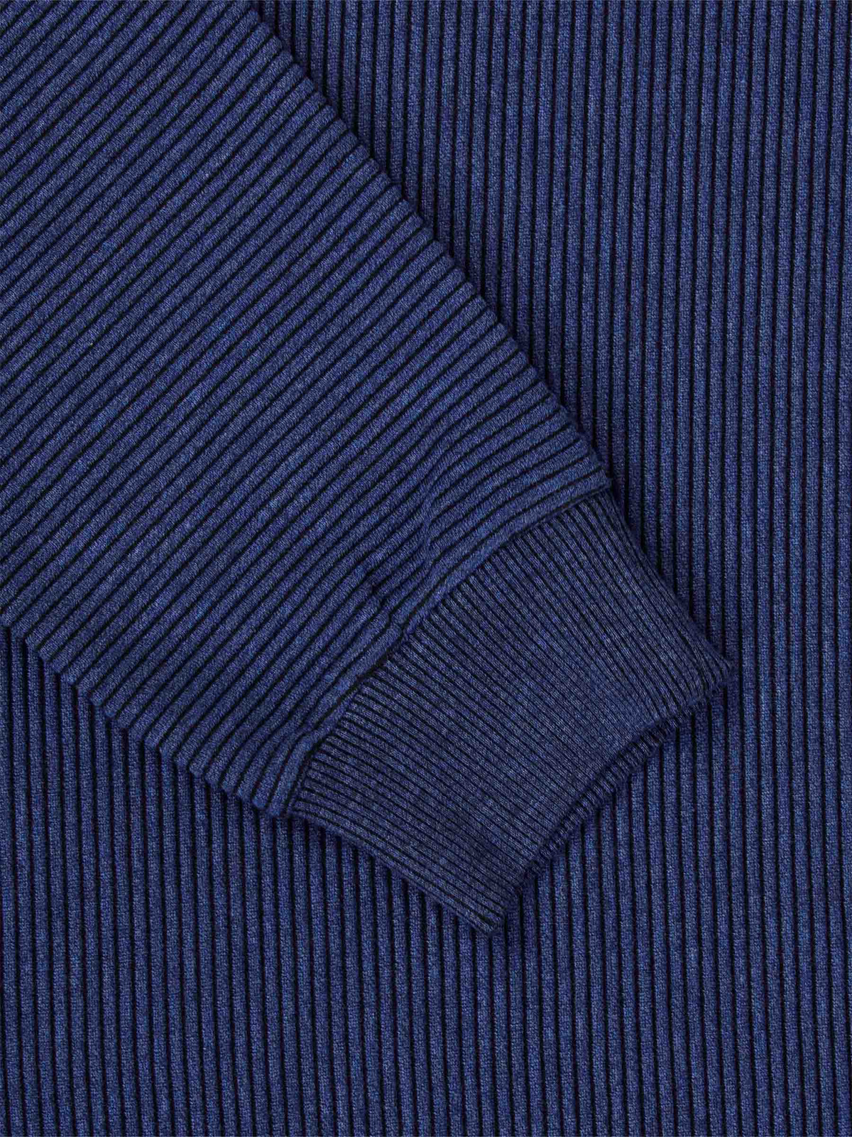 Close-up of the ribbed cuff and navy stripe knit on the sweater – Wam Denim.