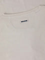 Close-up of The Fervor Light Beige Sweater back collar showing stitched Wam Denim label – Wam Denim.