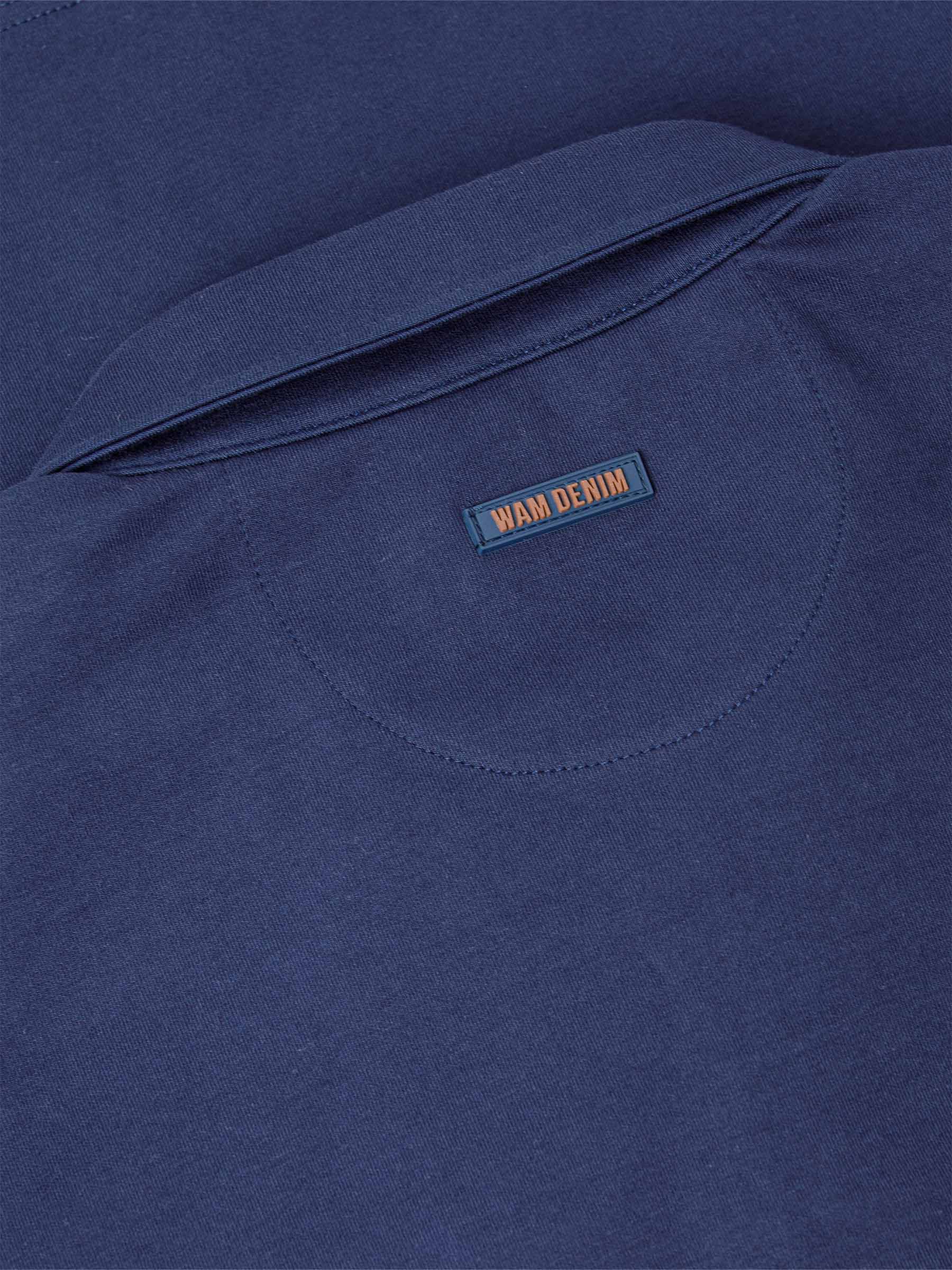 Close-up of a Navy Sweater with 'WAM DENIM' label.