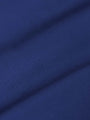 Close-up of royal blue shirt fabric showing smooth texture and fine weave.