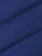 Close-up of royal blue shirt fabric showing smooth texture and fine weave.