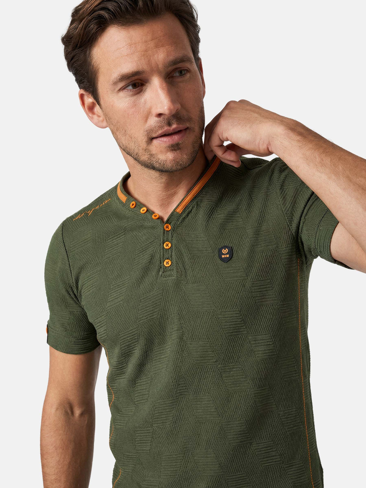Close-up of slim fit khaki men’s T-shirt with textured fabric and buttons