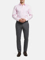 Model wearing pink dress shirt with grey trousers, smart formal outfit.