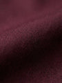 Close-up of dark red men’s shirt fabric showing smooth texture and premium weave