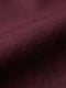 Close-up of dark red men’s shirt fabric showing smooth texture and premium weave
