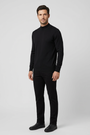Lux Black pullover on model, side view