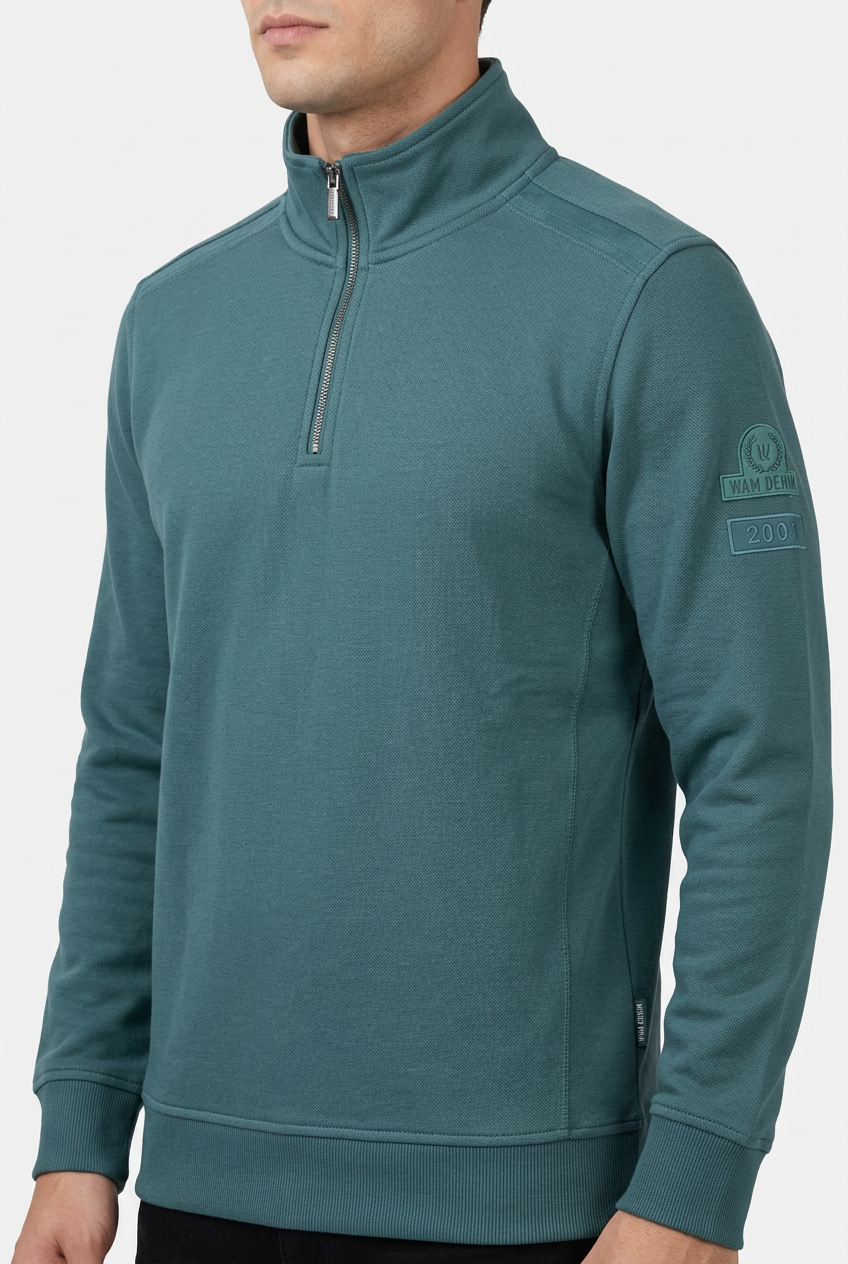Nerik Petrol sweater quarter-zip and sleeve patch detail on model