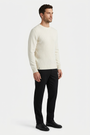 Poise Off White pullover on model, side view