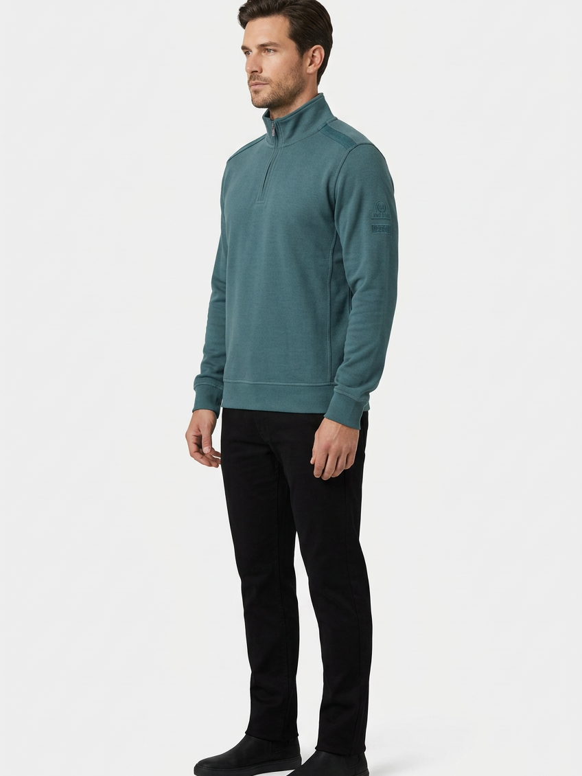 Nerik Petrol sweater on model, side view