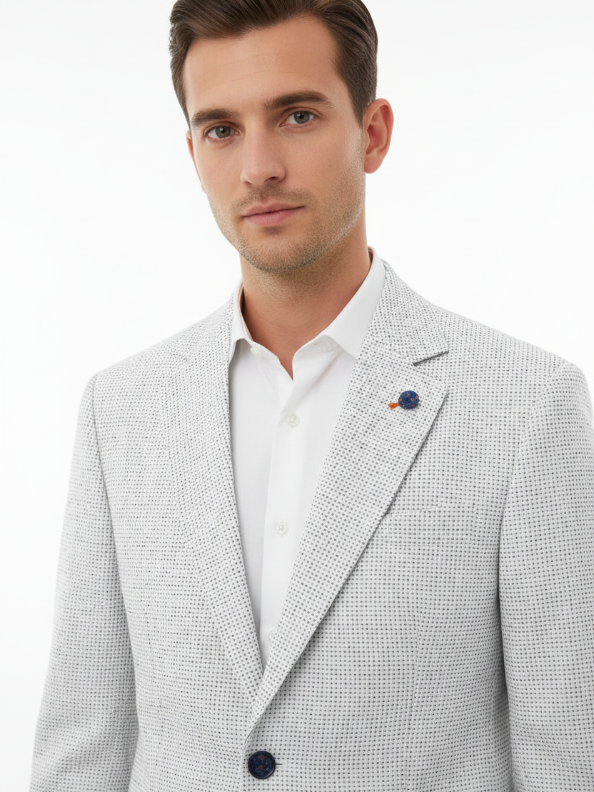 Lapel detail - white textured blazer on model