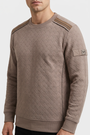 Thuron Light Brown sweater texture and sleeve detail on model