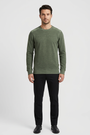Vurden Dark Green sweater on model, front view