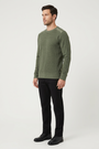 Vurden Dark Green sweater on model, side view
