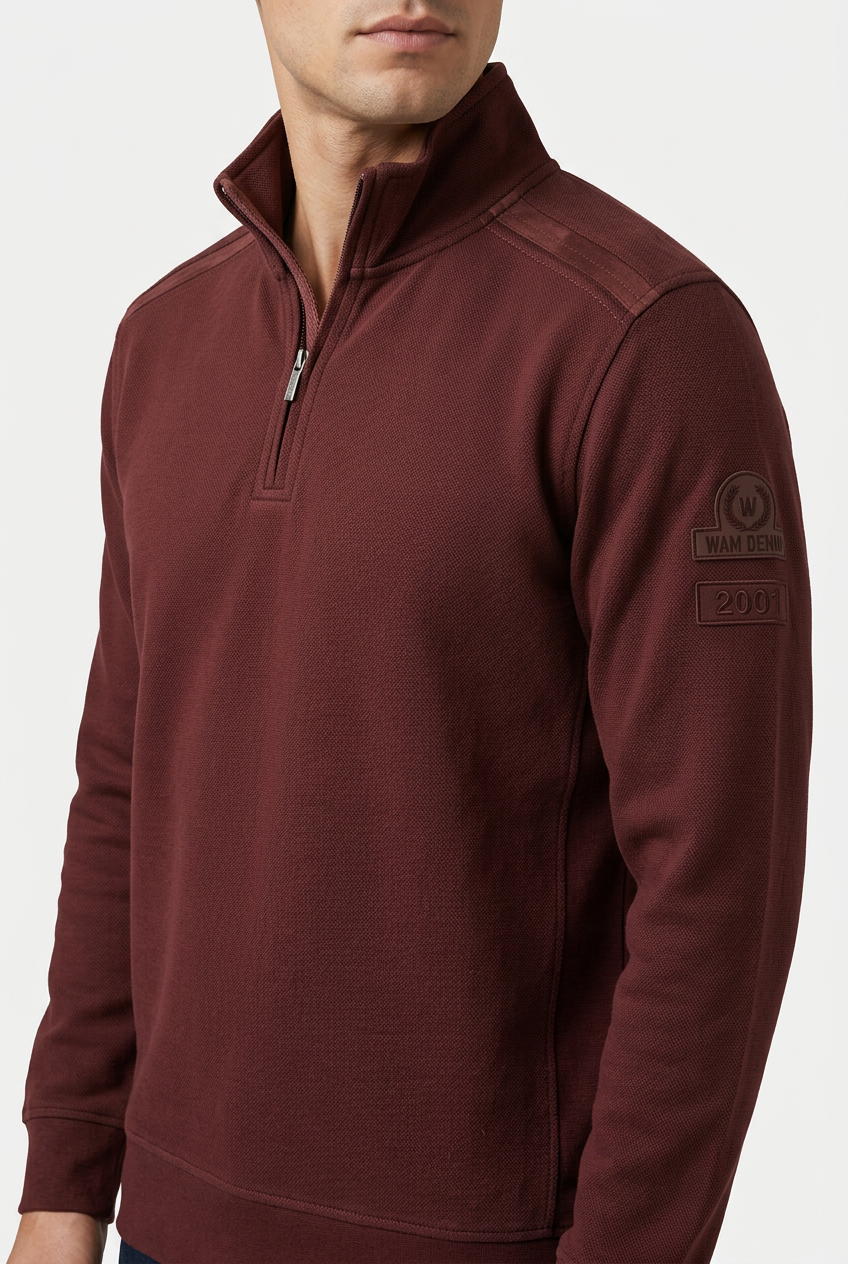 Nerik Dark Brown sweater quarter-zip and sleeve patch detail on model