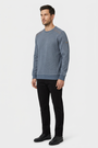 Daelor Blue sweater on model, side view