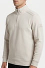 Nerik Light Beige sweater quarter-zip and sleeve patch detail on model