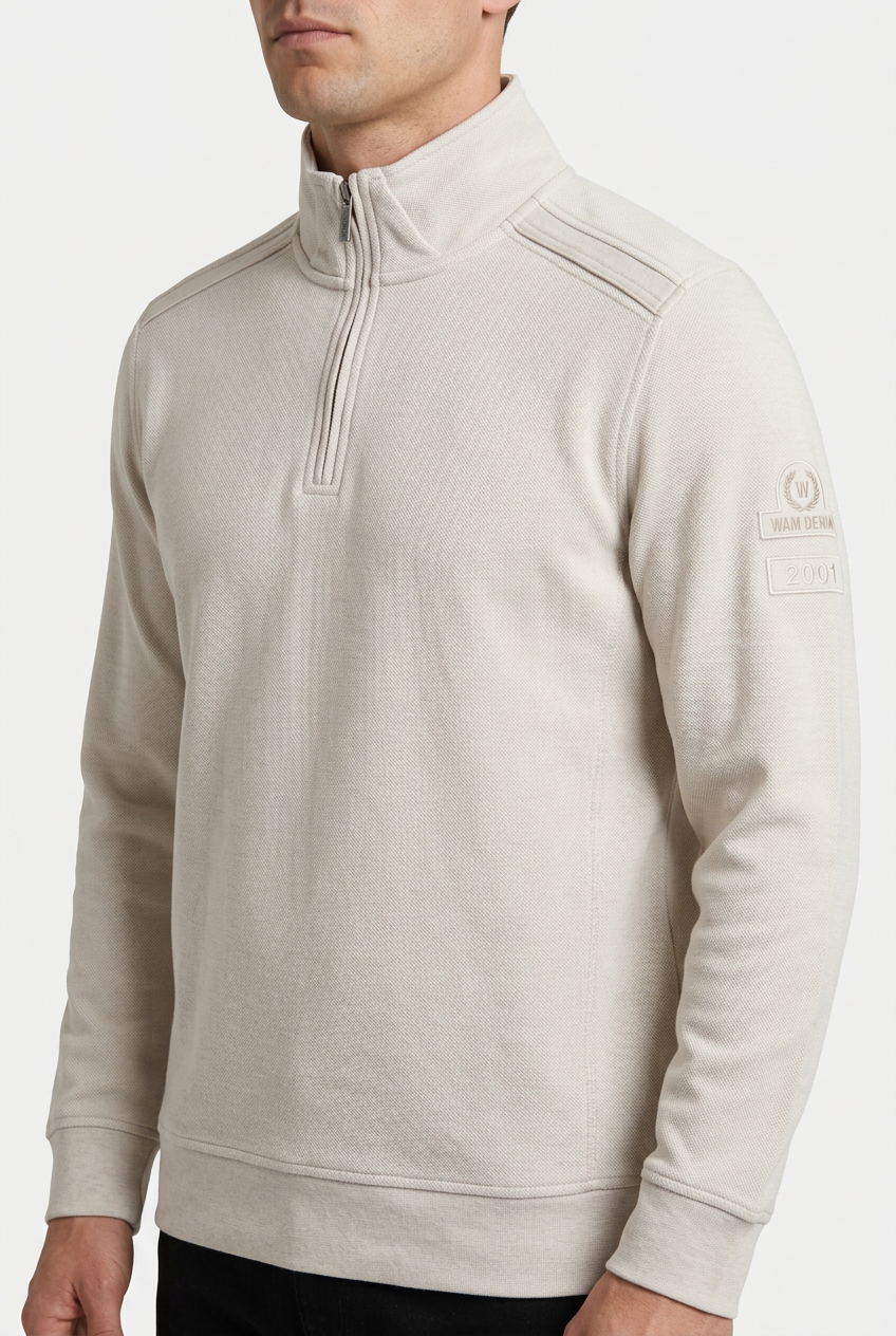 Nerik Light Beige sweater quarter-zip and sleeve patch detail on model