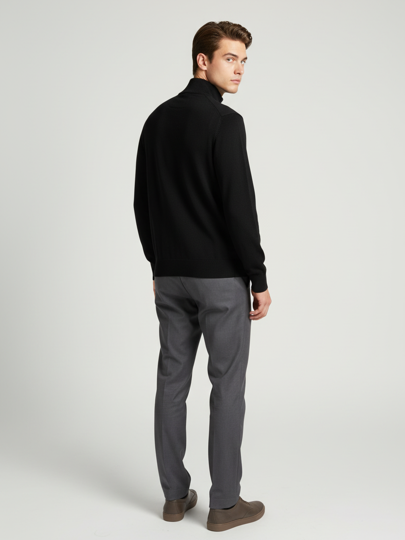 Back view of a male model wearing the Sharp black sweater with Wam Denim neck branding